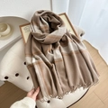 Thick plaid winter scarf in earthy khaki and orange tones with elegant long fringe detail - Camel