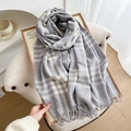 Classic light grey and white plaid patterned scarf with fringes on a display board - Lavender