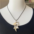 Handcrafted toucan pendant necklace with natural abalone and white shell on black cord - Parrot