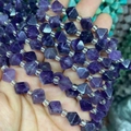 Macro view of purple faceted amethyst beads showing natural stone texture and geometric cut - Amethyst 1 Strand