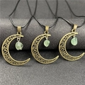 Macro detail of bronze crescent moon pendants with translucent green crystal stones - 1Pc Green Strawberry Quartz