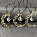 Detail of three bronze moon pendants with clear raw crystals on black wax cords - Clear Quartz 1pc