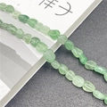 Detailed view of natural irregular green aventurine beads for DIY jewelry making - Green Strawberry Quartz