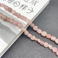 Macro detail of irregular natural rose quartz crystal beads with internal textures - Rose Quartz
