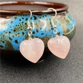 Sweet heart-shaped rose quartz drop earrings with silver hooks on a ceramic dish - Rose Quartz