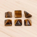 Tiger eye stone pyramid gemstones in golden brown with natural silk luster and patterns - Tiger's Eye