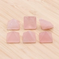 Pink crystal pyramid stone cabochons for DIY jewelry making on wooden background - Rose Quartz