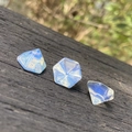 Polished light blue hexagonal crystal pyramids for DIY jewelry and nail art - Synthetic Opal