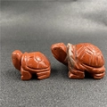 Two red jasper turtle figurines with natural stone texture and carved shell patterns - One 1.5-inch Rainbow Stone
