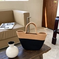 Two-tone hand-woven cotton rope tote bag with black and beige contrast on a wooden bench - Black Khaki