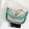 Detail of floral quilted cotton coin purse with green corduroy trim and button closure - Green Floral