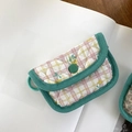 Macro detail of quilted floral coin purse showing green button and checkered fabric pattern - Yellow Plaid Floral