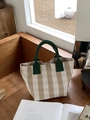 Minimalist canvas tote bag with striped pattern and dark green top handles on wooden bench - Beige Stripes (A072201)