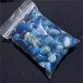 Macro detail of blue lace agate oval stones with natural stripes in a transparent bag - Blue Banded Agate (1 Piece)