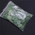 Close-up of polished green agate oval stone beads for DIY jewelry making in a plastic bag - Green Aventurine 1PC