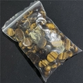 Bulk natural tiger eye oval cabochons with golden brown chatoyant bands in plastic bags - Tiger's Eye