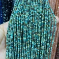 Close-up of 2-3mm faceted amazonite abacus beads with natural blue-green textures - African Turquoise 1 Strand