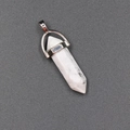 Hexagonal white turquoise bullet pendant with silver metal bail on a dark background - Howlite