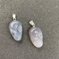 Pair of gray agate skull pendants with fine stone carvings and silver metal clasps - Grey Agate