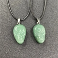 Alien skull pendants carved from green aventurine stone with black woven cord - Green Aventurine