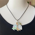 Minimalist rabbit pendant necklace featuring white and abalone shell on black cord - Rabbit