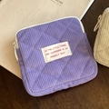 Purple corduroy quilted cosmetic bag with zipper and decorative woven label - Purple