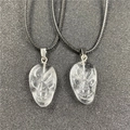 Pair of carved clear crystal skull pendants with minimalist black woven cord necklaces - Clear Quartz (Synthetic)