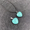 Turquoise heart pendant necklace with black cord and natural stone texture patterns - Synthetic Blue Turquoise