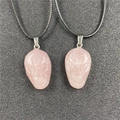 Hand-carved rose quartz skull pendant necklace with black cord and adjustable metal clasp - Rose Quartz