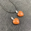 Orange goldstone heart pendant with sparkling minerals and black woven necklace cord - Goldstone (Synthetic)