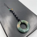 Natural green jadeite donut pendant with black braided rope and bead accents - India Agate