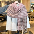 Pink and brown checkered scarf with fringe worn over a beige wool coat in a warm winter style - Pink & Light Brown Plaid