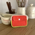 Mini canvas coin purse in bright red and neon yellow with button pocket and zipper - Orange