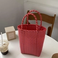 Handmade woven PVC tote bag in pink and orange stripes with dual round handles - Watermelon red