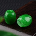 Emerald green natural stone barrel bead 16x18mm with polished finish on wooden stand - 1 Piece / Malaysian Jade (Dyed)