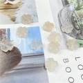 Detailweergave van doorschijnende witte agaat kruisvormige kralen voor DIY sieraden - Agaat