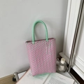 Pink and mint green hand-woven PVC tote bag with stylish contrasting color design - Pink and Green