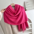 Bright rose pink knitted scarf with fringe detail styled on a beige winter coat - No.14 Rose Red
