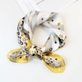 Silk square scarf with yellow and grey stripes and purple floral prints in a bow shape - Yellow Edge