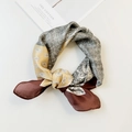 Golden yellow and grey silk scarf with paisley and herringbone patterns in a ring knot - Natural With Coffee Edge