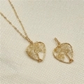 Golden tree of life heart necklace with yellow citrine crystals on beige fabric - Citrine (Yellow Chips)