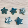 Five polished 30mm moss agate star-shaped stones with natural green and white textures - Moss Agate