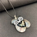 Owl pendant necklace featuring colorful abalone shell inlay and a black wax cord strap - Owl Style 3