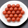 Polished natural Red Jasper stone spheres with unique black mineral veins in 16-piece set - Red Jasper