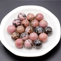 Polished 16mm natural rhodonite stone spheres with pink and black marbled textures - Rhodonite