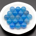 Polished 16mm blue agate stone sphere with natural textures on white ceramic plate - Blue Agate