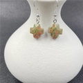 Handmade unakite stone cross earrings with silver hooks on minimalist white vase - Unakite