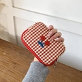 Red checkered makeup coin purse with cherry embroidery held in hand for scale - S