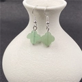 Green aventurine clover drop earrings with silver hooks hanging on a white ceramic vase - Green Aventurine 1 Pair
