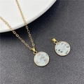 Blue-grey natural stone round pendant with gold bezel on a fine link chain necklace - Tianshan Blue